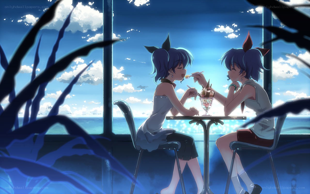 Two girls sharing dessert