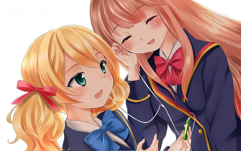 Two girls sharing headphones