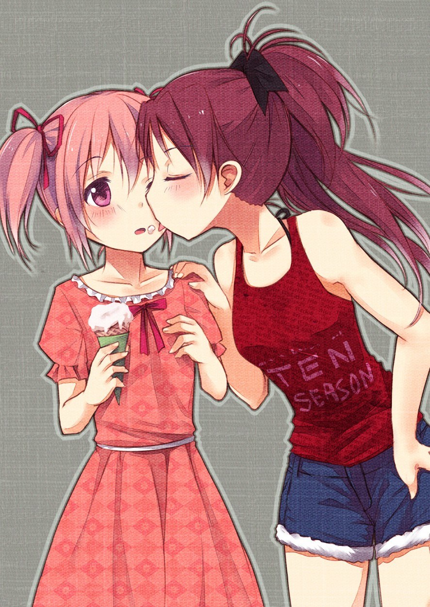 Two girls sharing ice cream