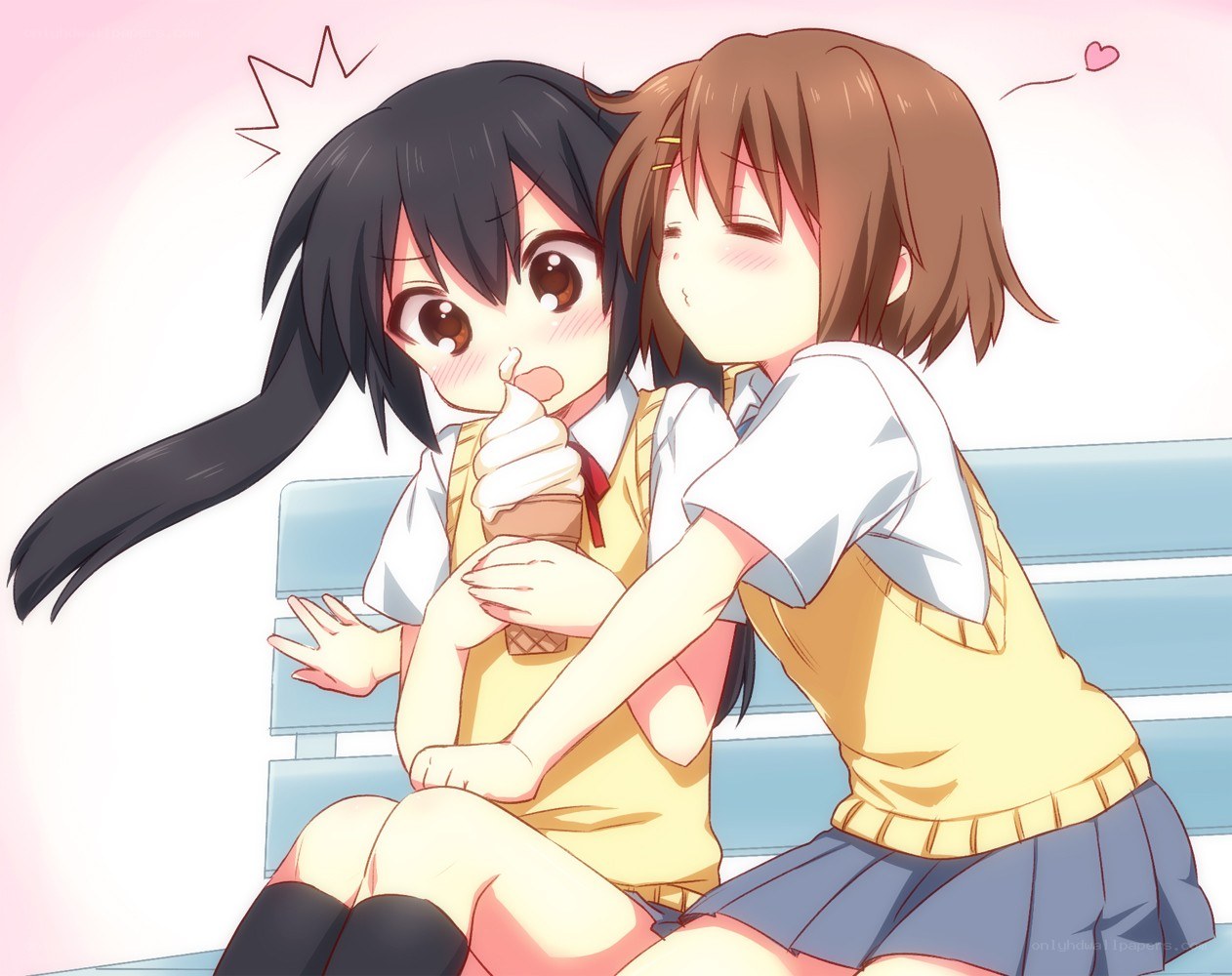 Two girls sharing ice cream