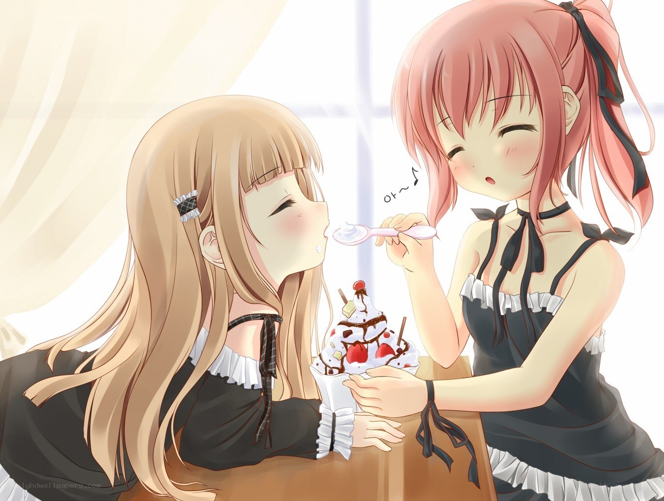 Two girls sharing ice cream