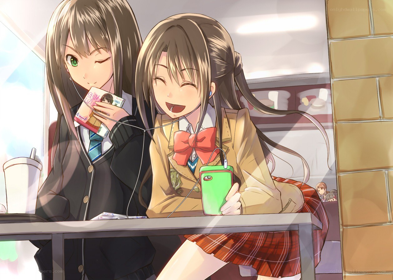 Two girls sharing music