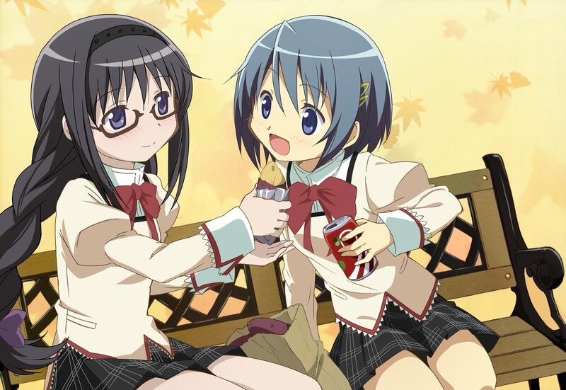 Two girls sharing snacks on a bench
