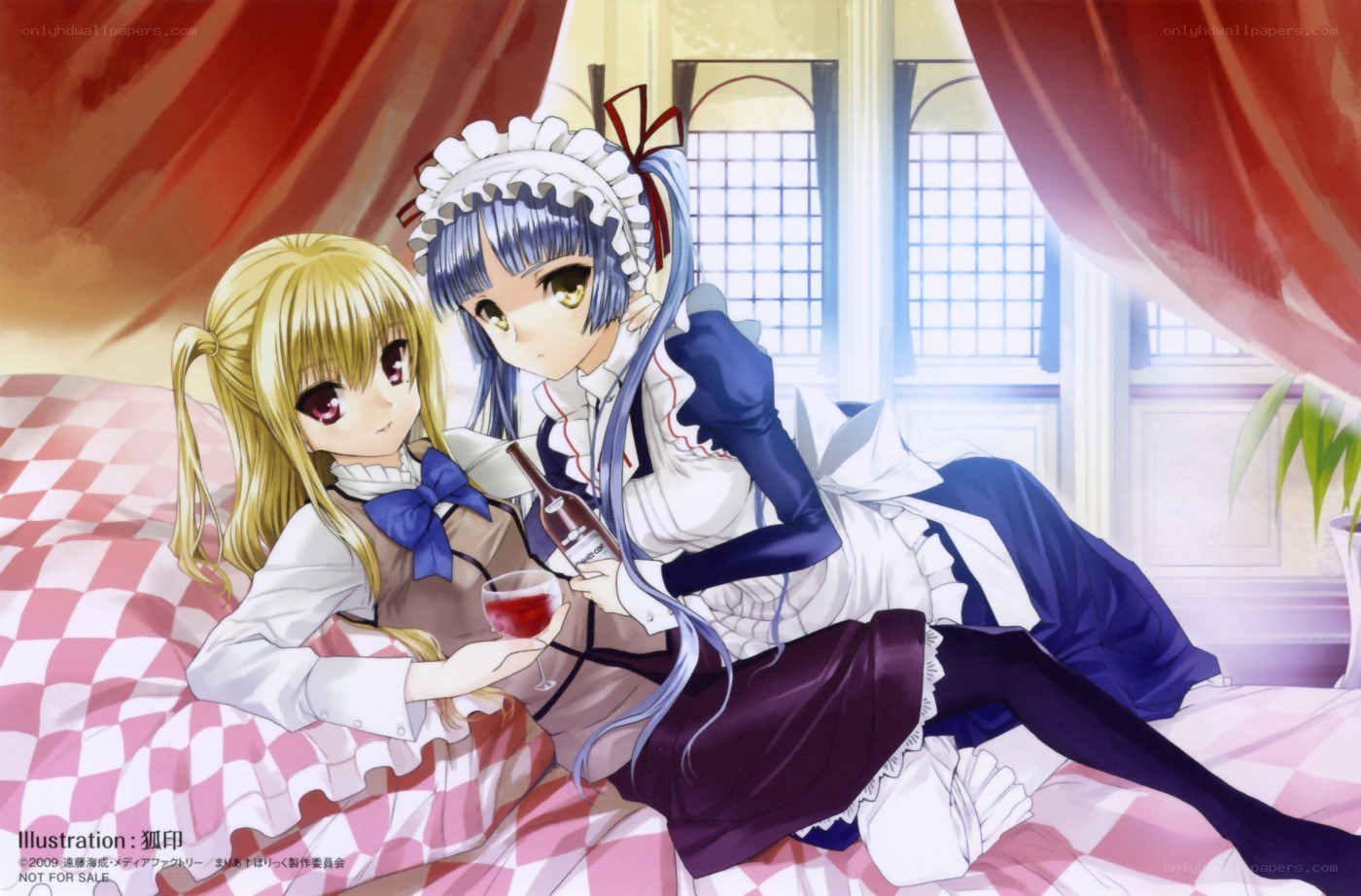 Two girls sharing wine in bed