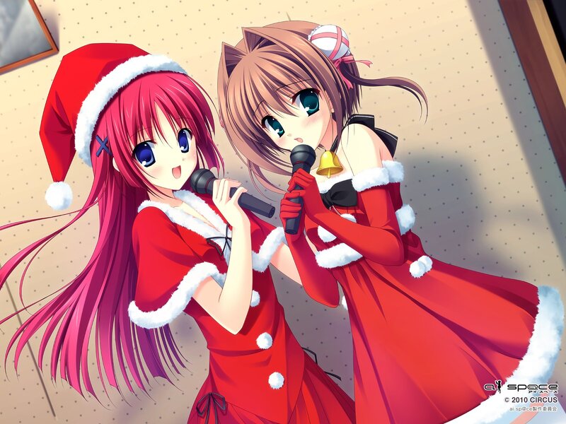 Two girls singing in Santa outfits