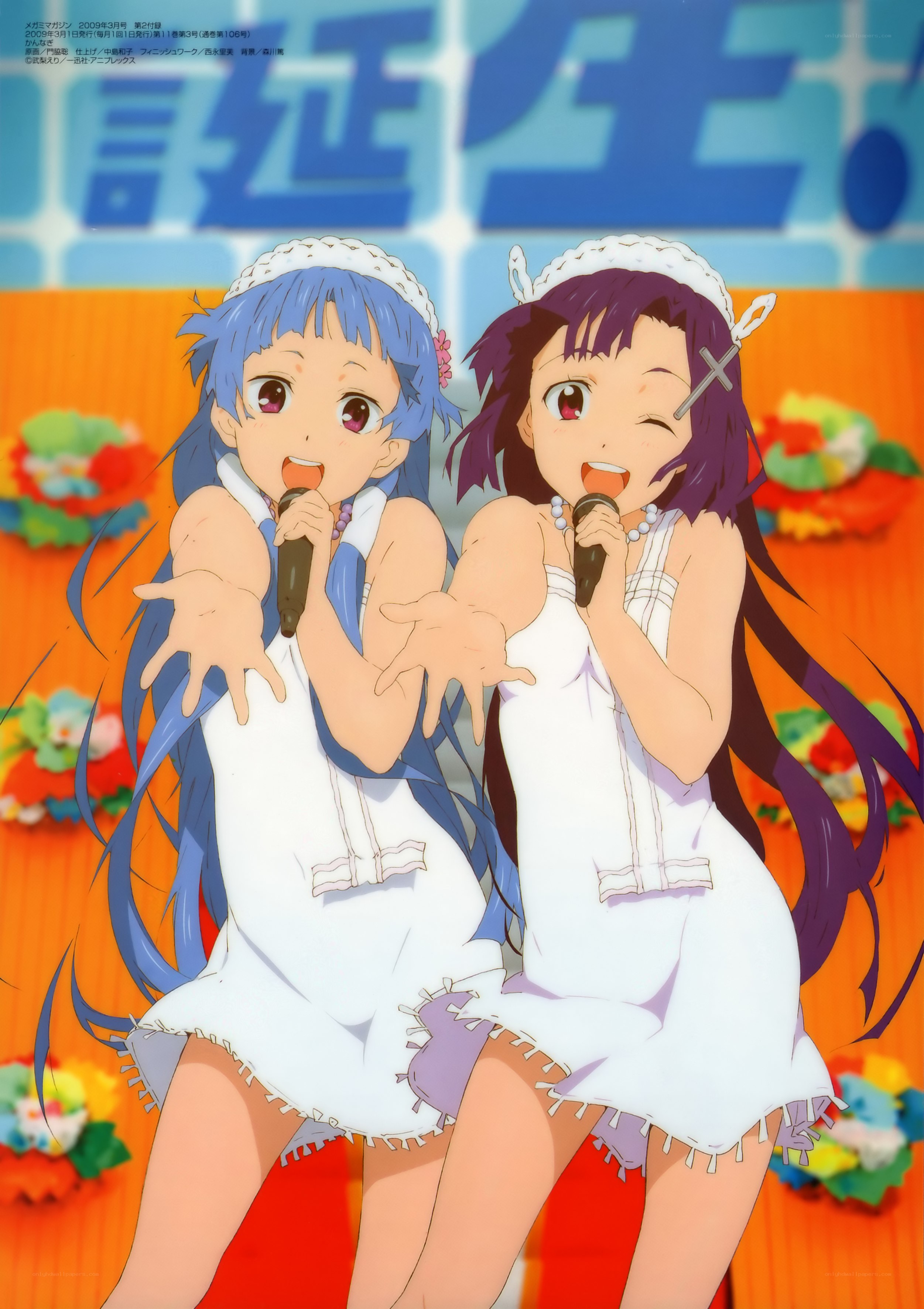 Two girls singing on stage