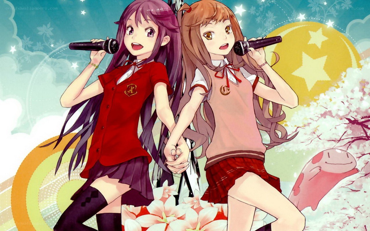 Two girls singing with microphones