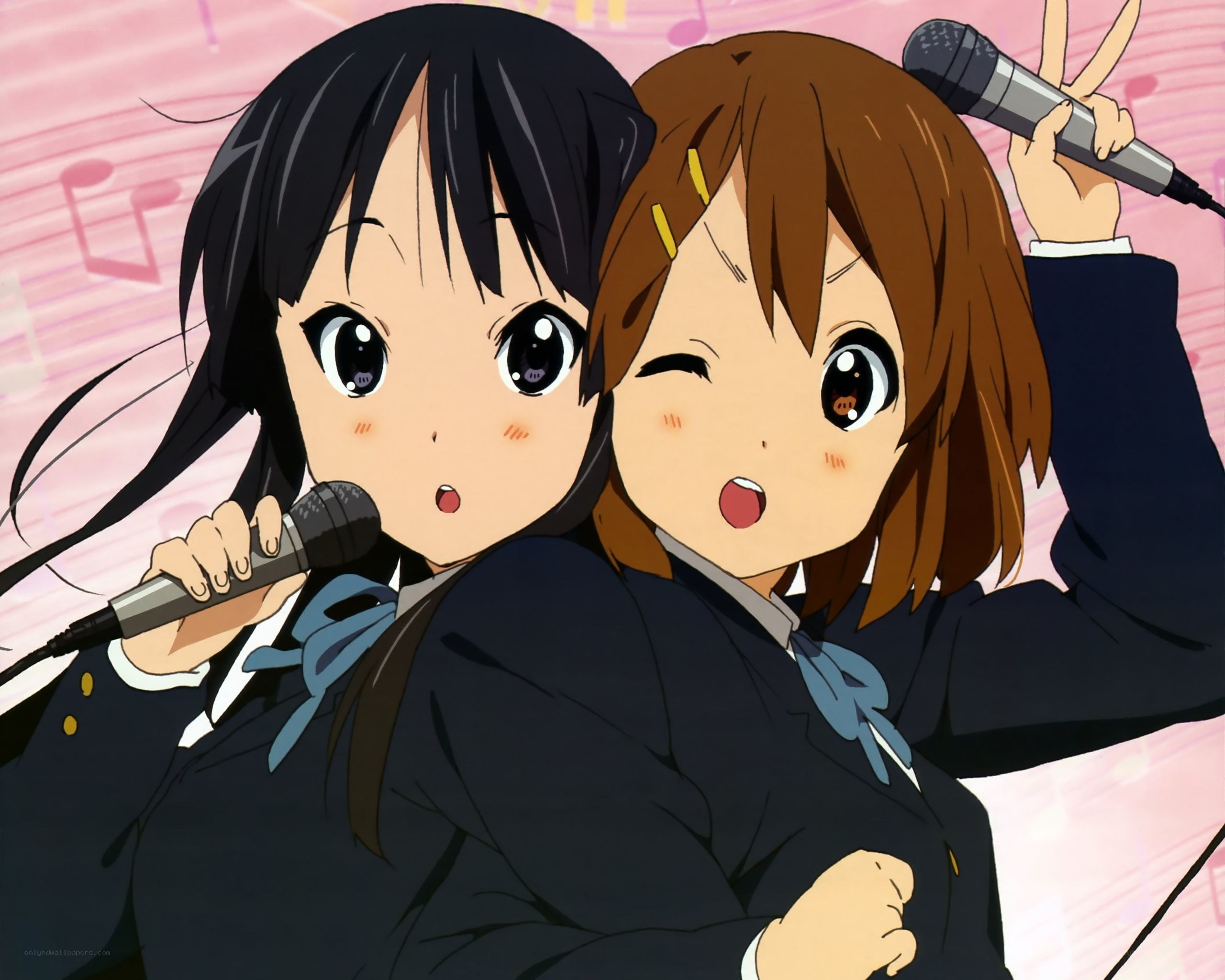 Two girls singing with microphones