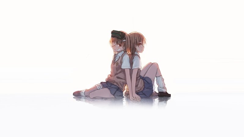 two girls sitting back to back