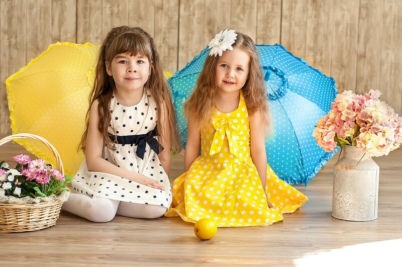 Two Girls Sitting on Floor — Yellow