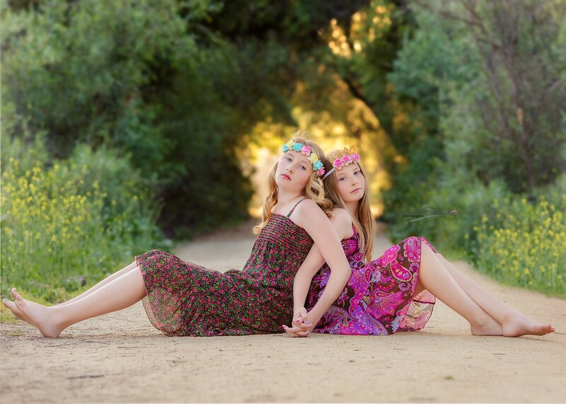 Two Girls Sitting on Path