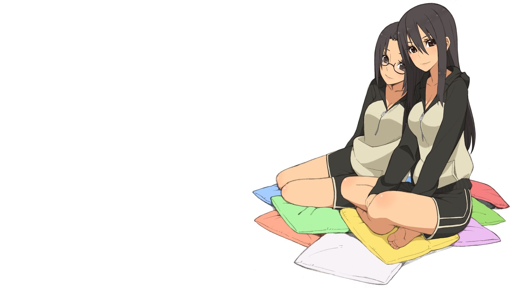 two girls sitting on pillows
