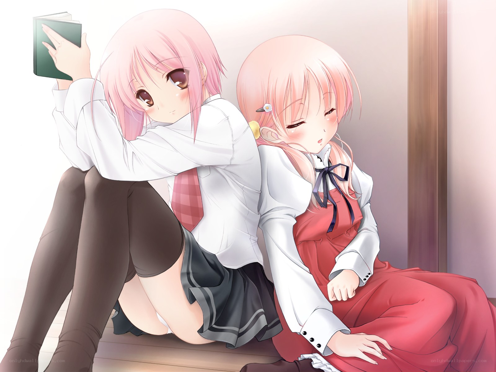 Two girls sitting together