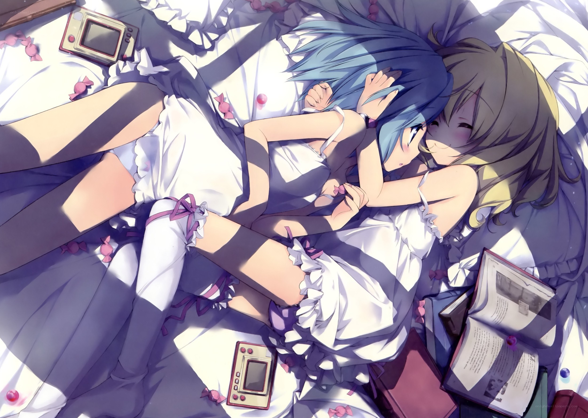 Two girls sleeping in bed