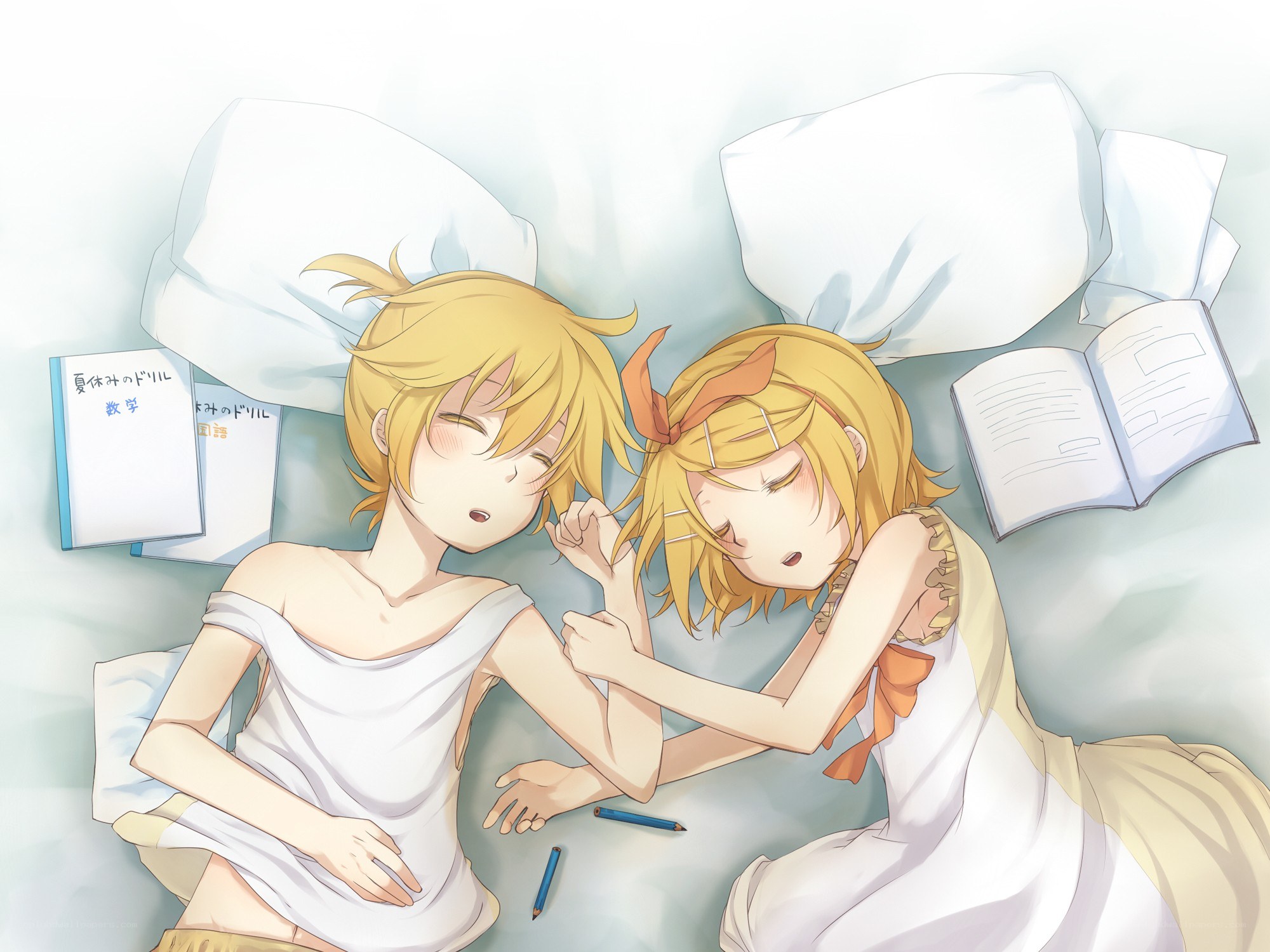 Two girls sleeping on a bed