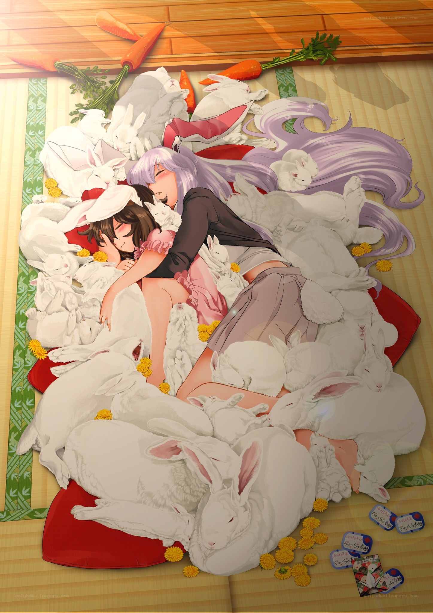 Two girls sleeping with rabbits