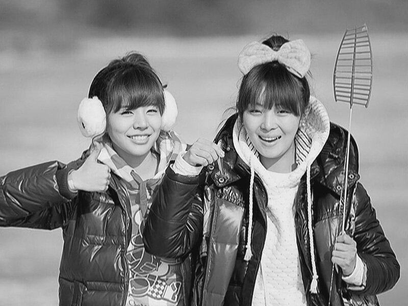 two girls smiling outdoors