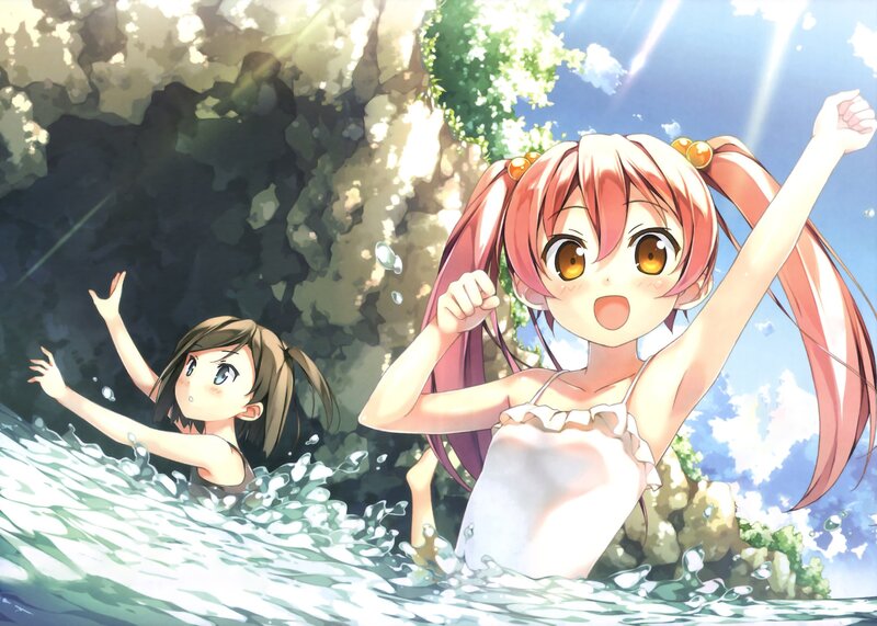 Two girls swimming in a pool