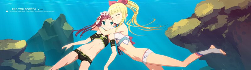 Two girls swimming underwater