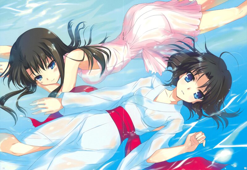 Two girls swimming underwater