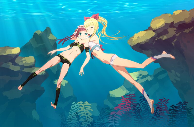 Two girls swimming underwater