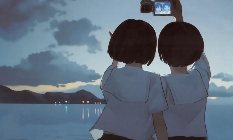 two girls taking a selfie at dusk