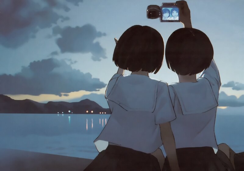 Two girls taking a selfie at dusk