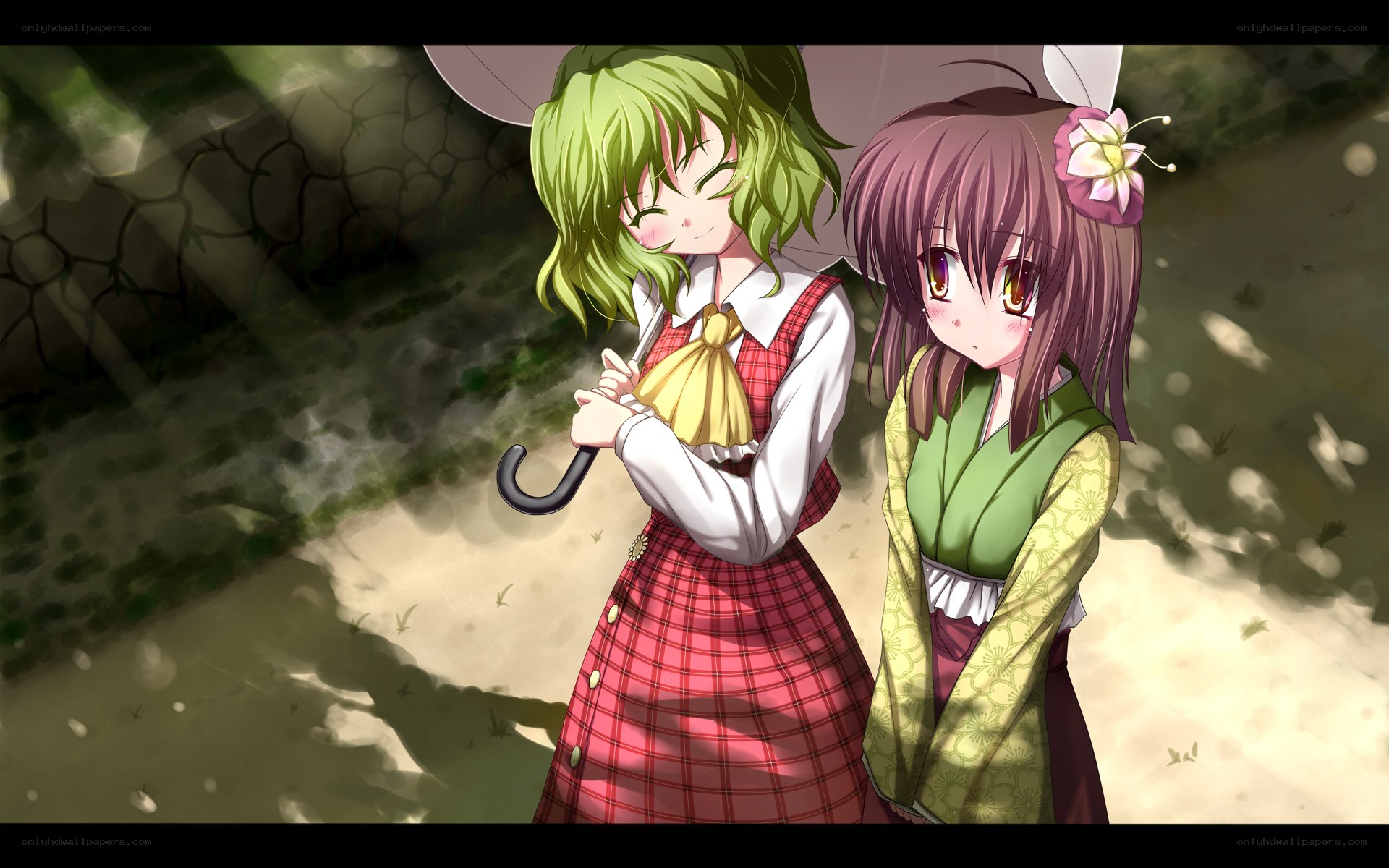 Two girls under an umbrella
