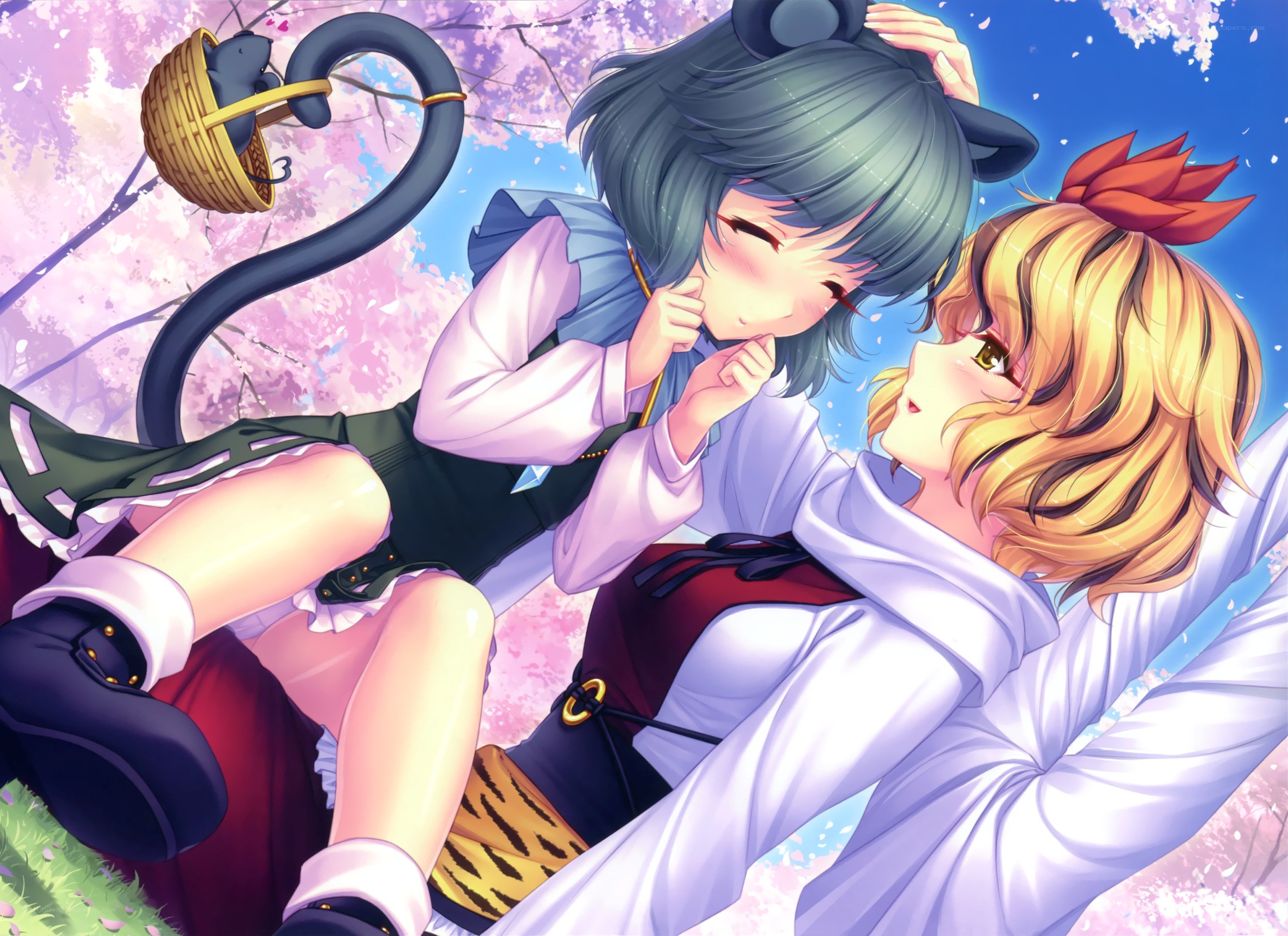 Two girls under cherry blossoms