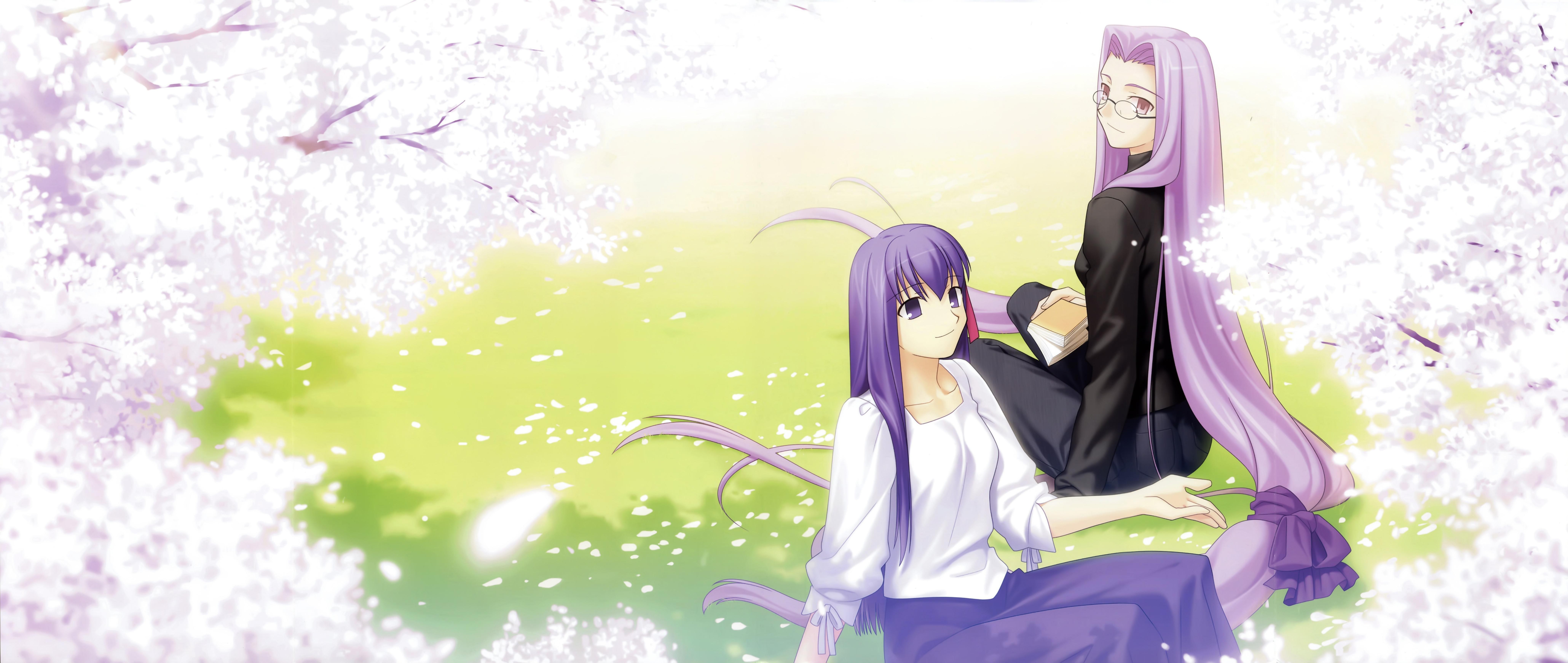 Two girls under cherry blossoms