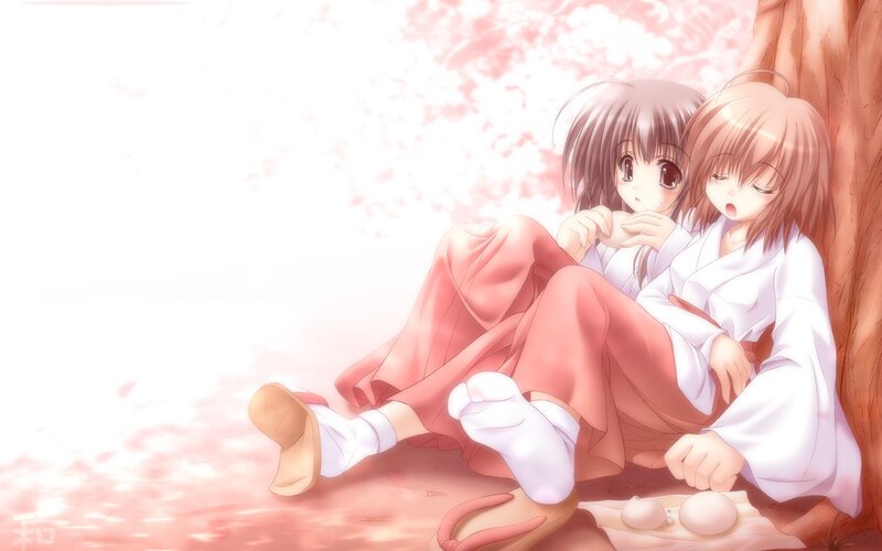 Two girls under cherry blossoms