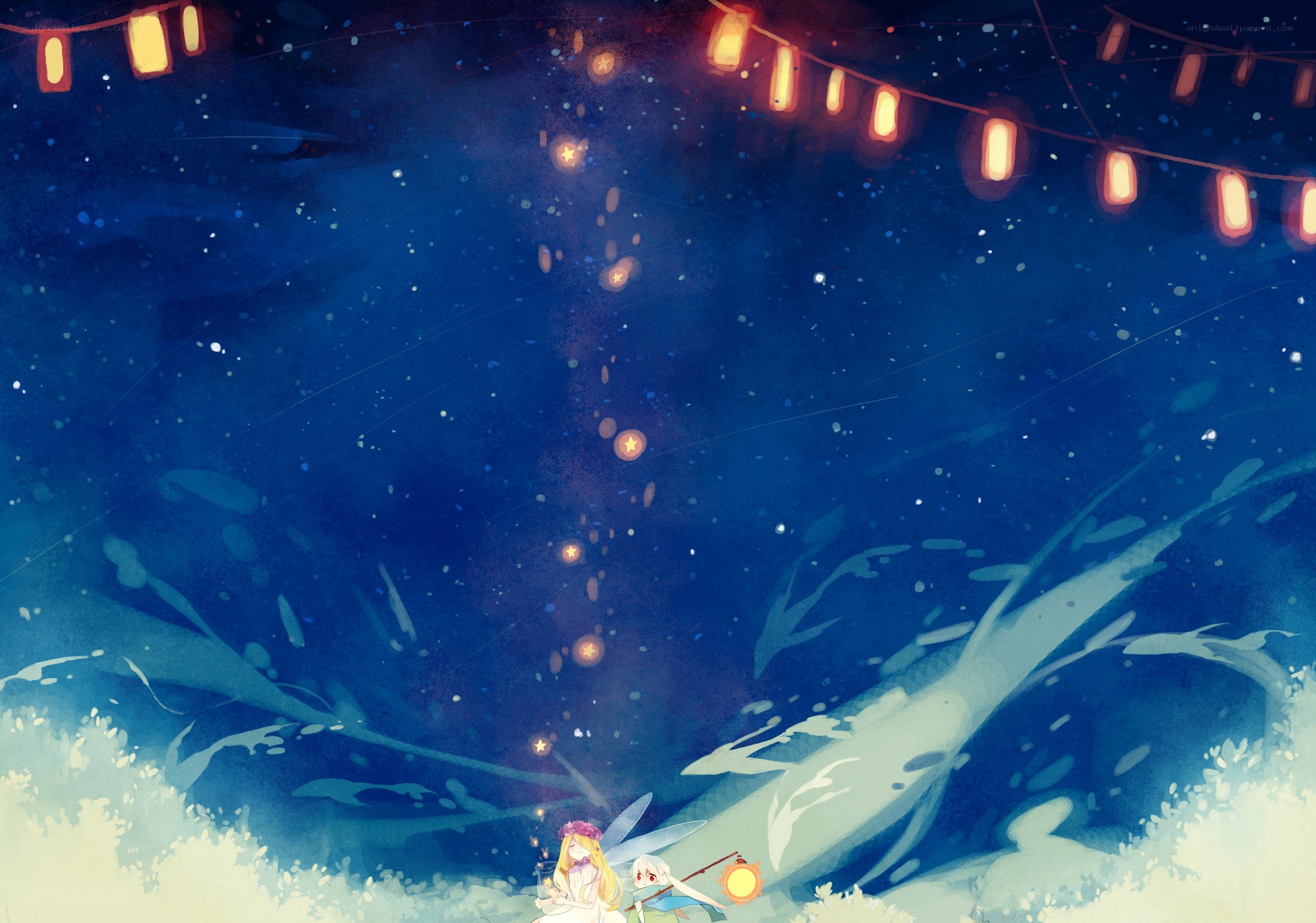 Two girls under lanterns at night
