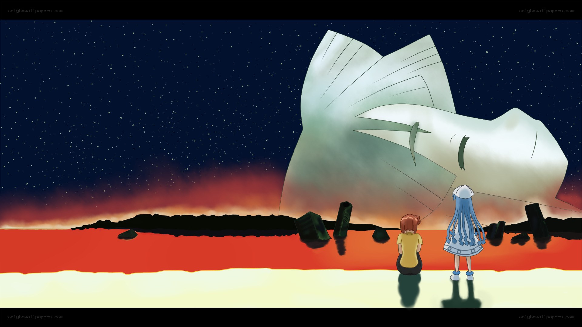 two girls view a giant statue