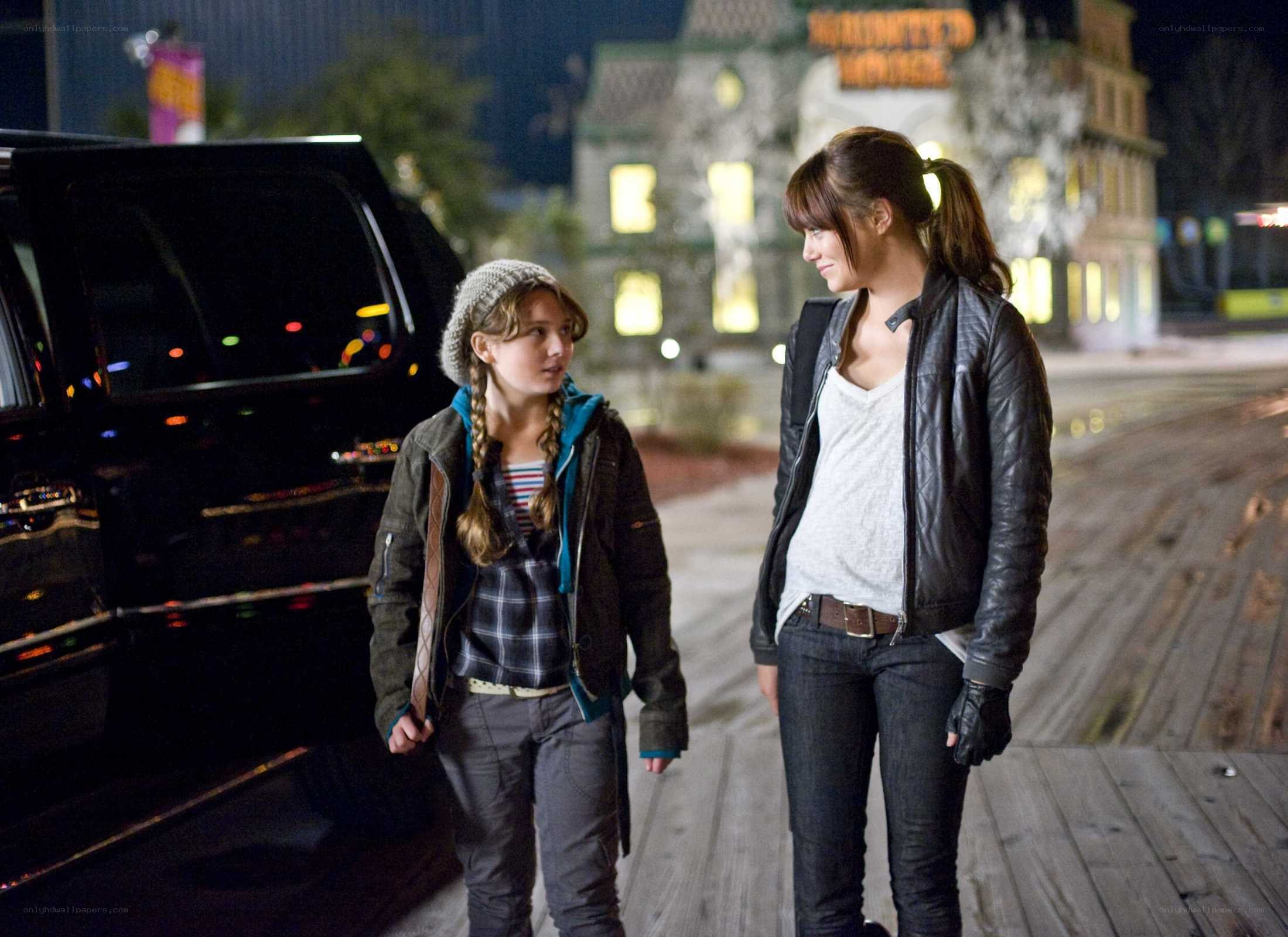 Two girls walking at night