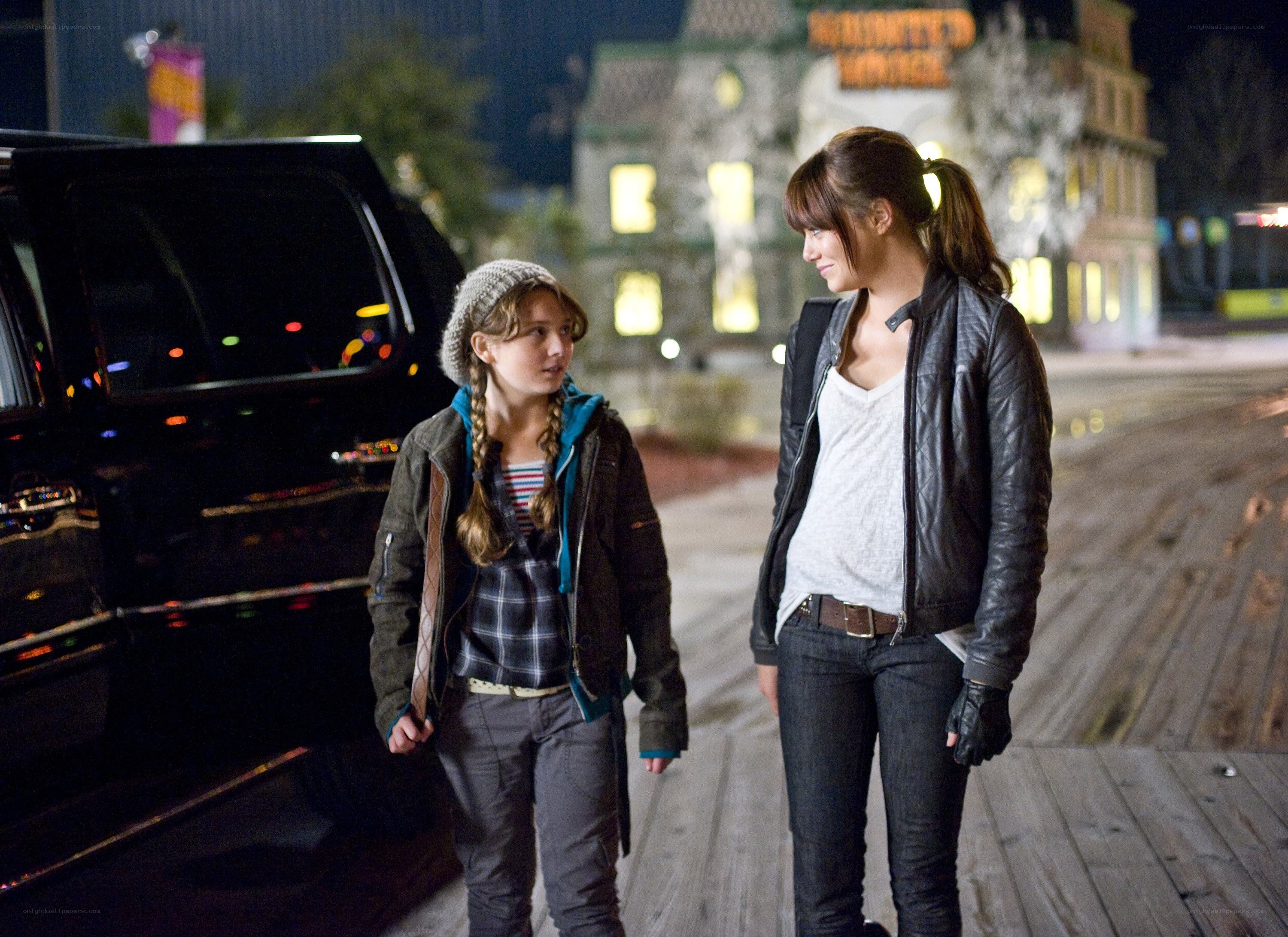 Two girls walking at night