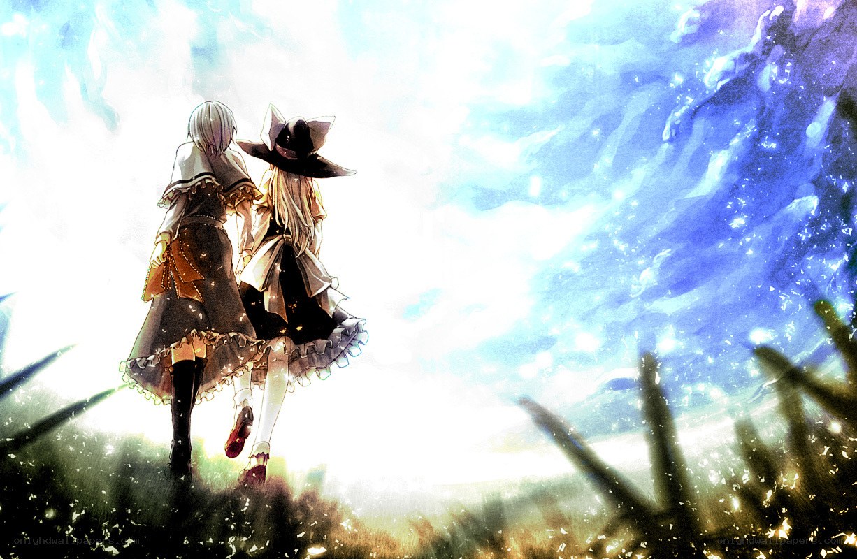 two girls walking in a field