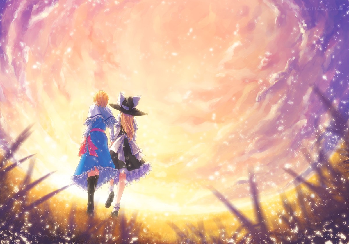 two girls walking into sunset