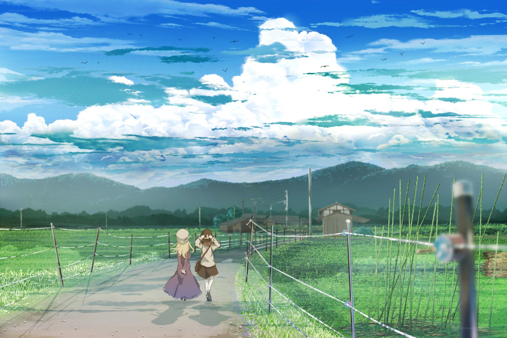 Two girls walking on a rural path