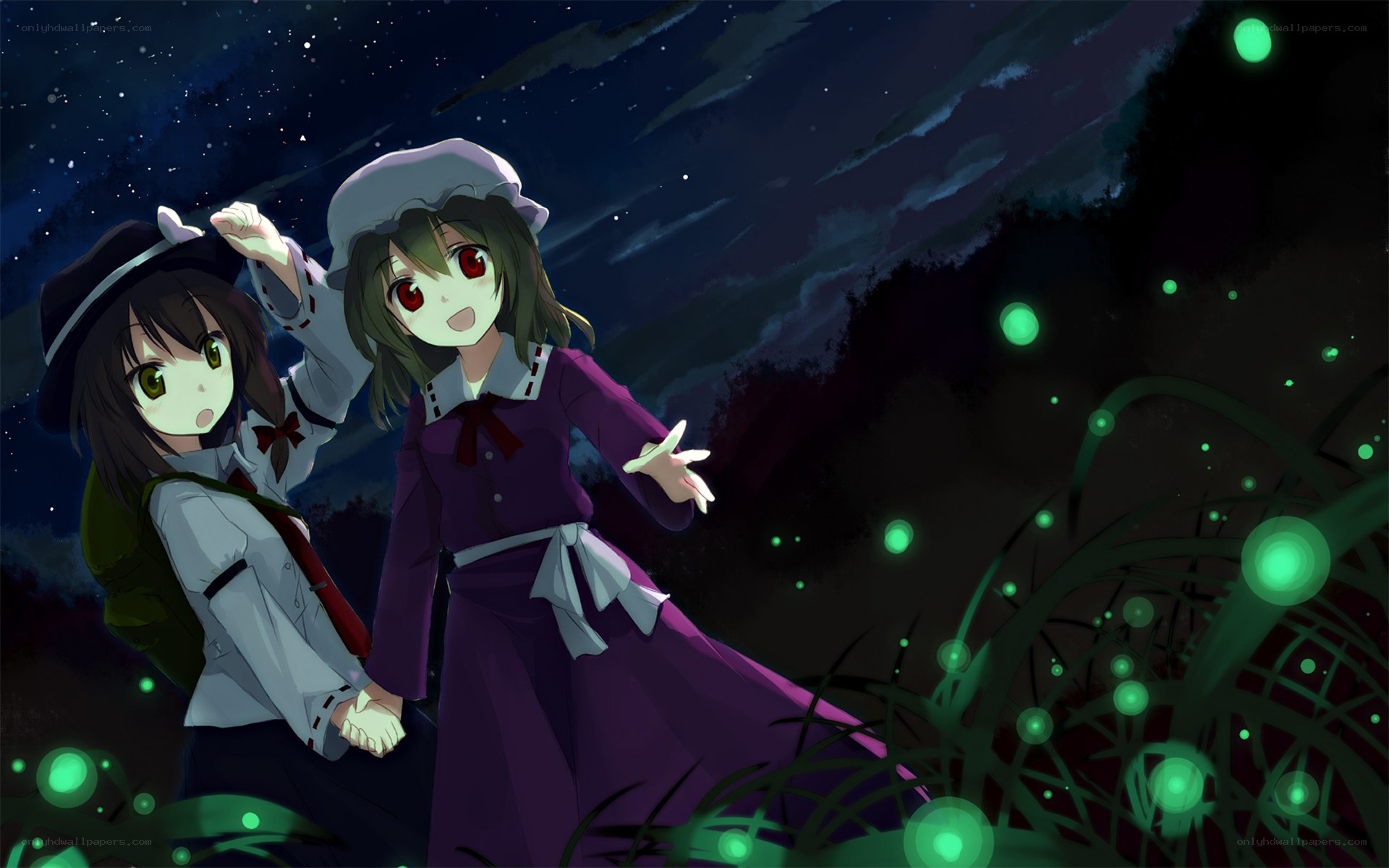 Two girls watching fireflies at night