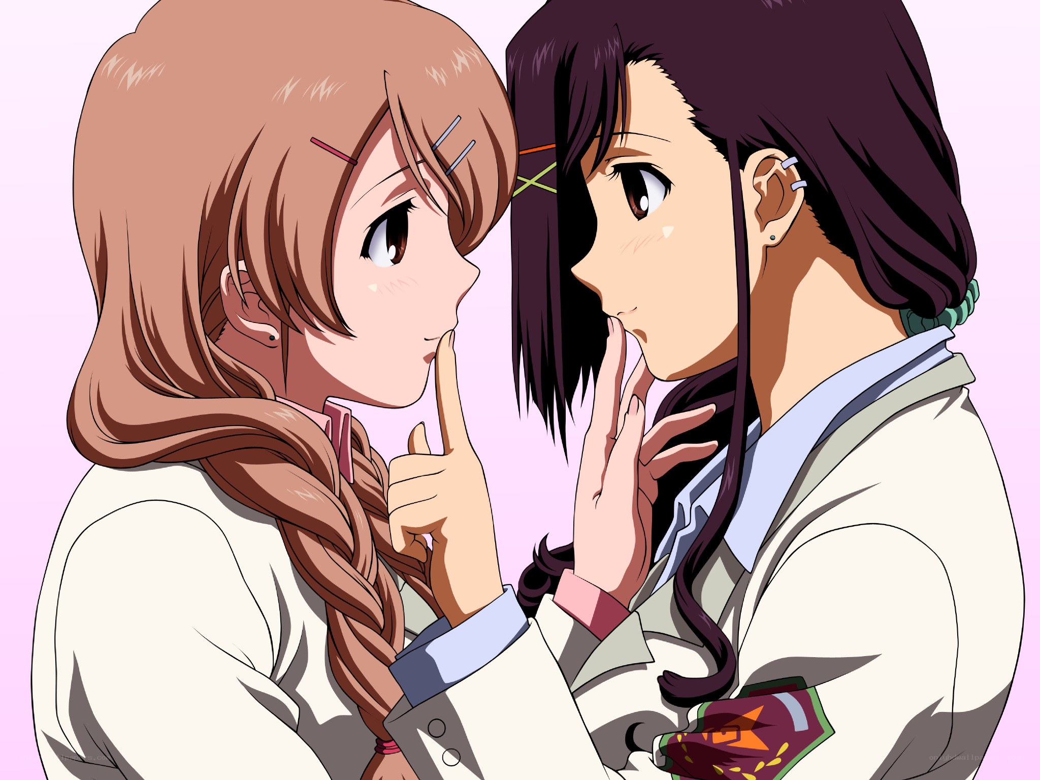 Two girls whispering secrets