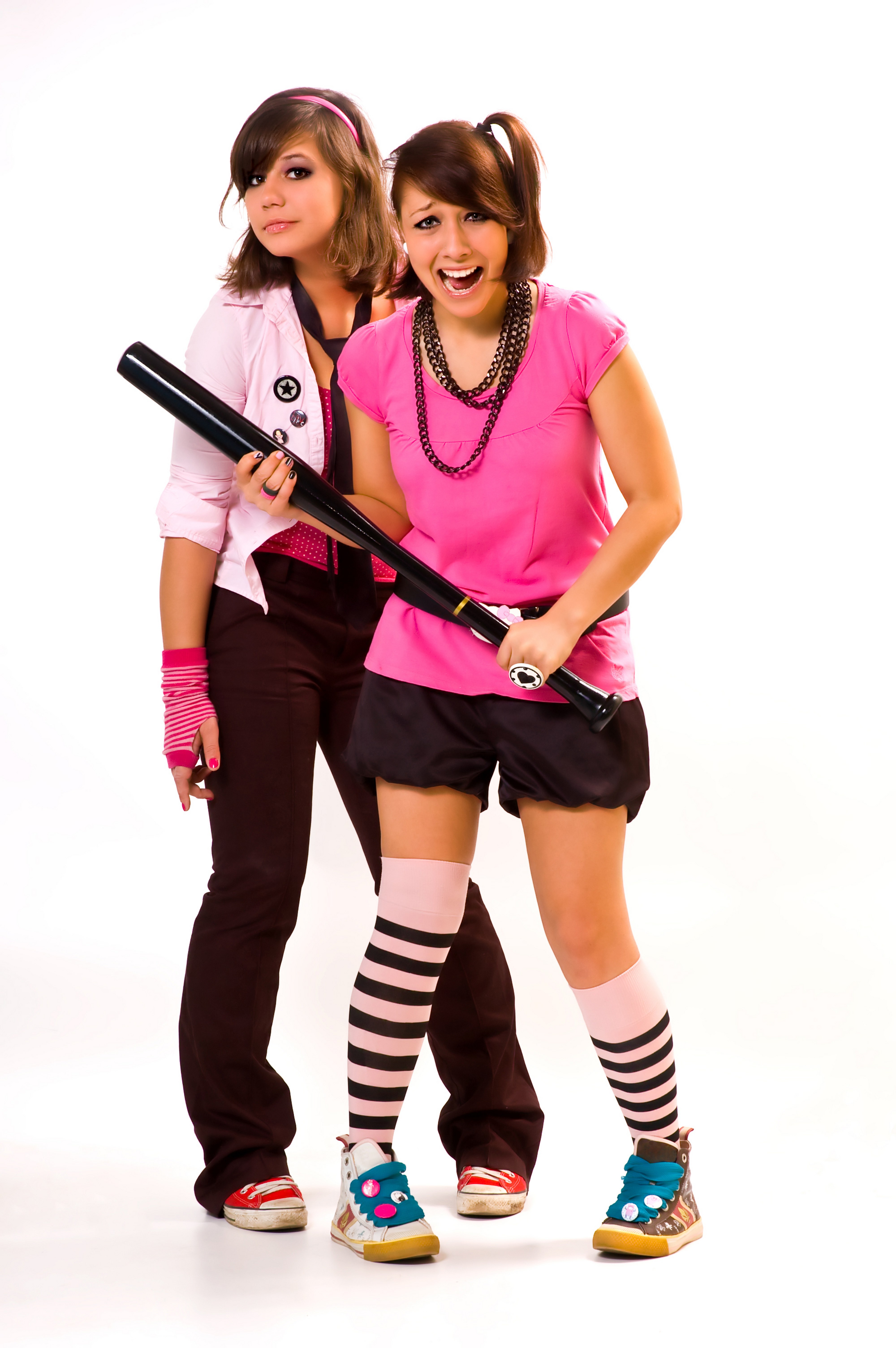 Two girls with a bat