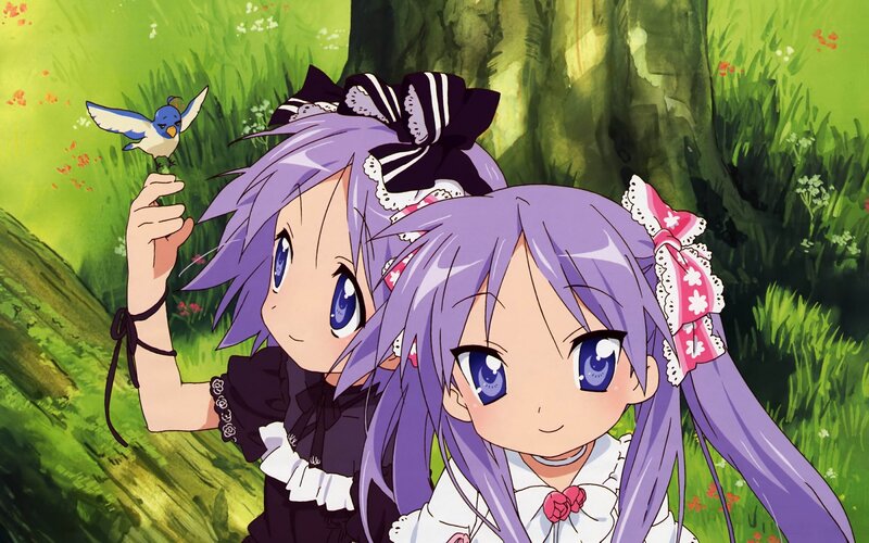 two girls with a bird in the forest
