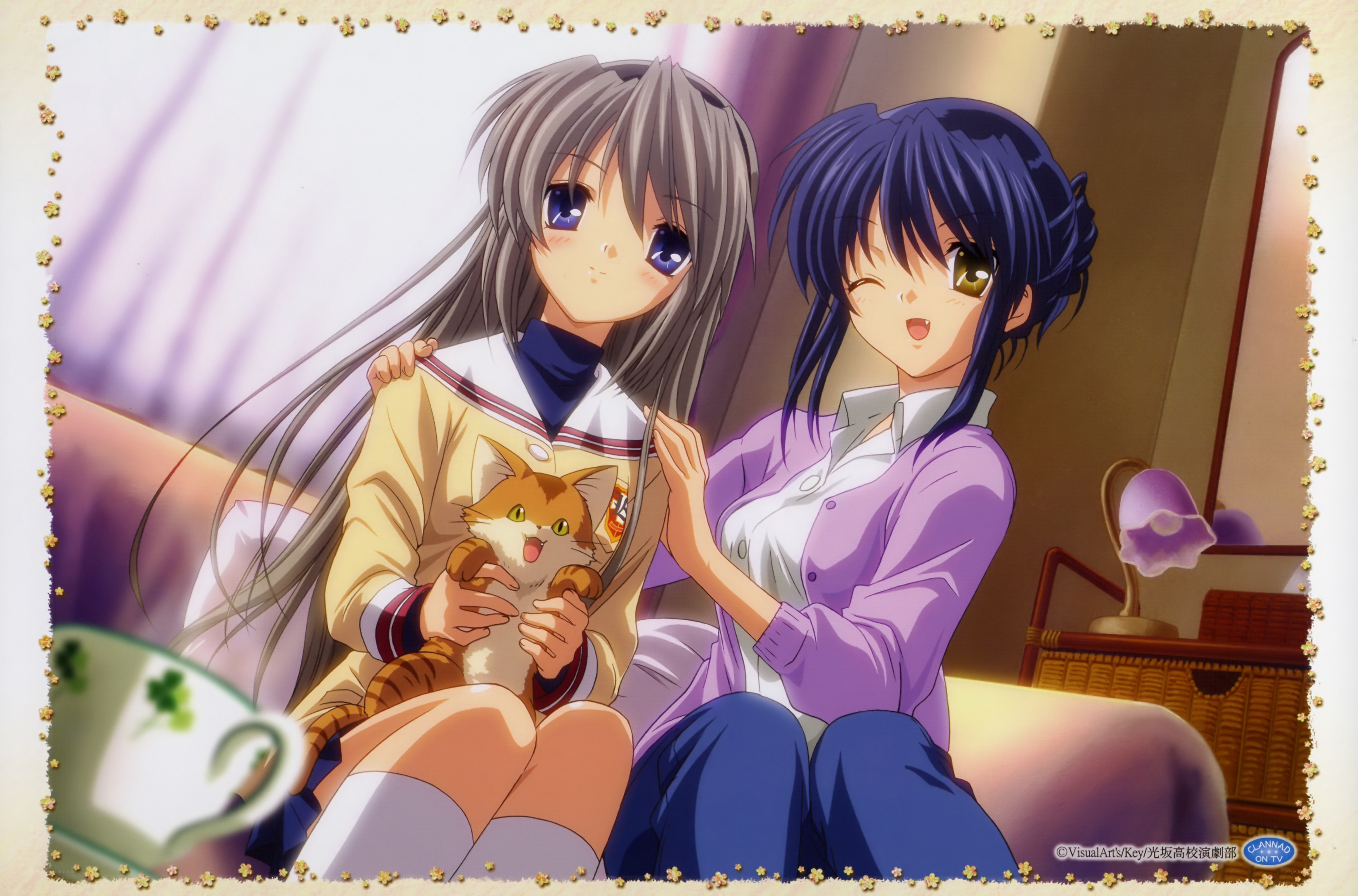 Two girls with a cat