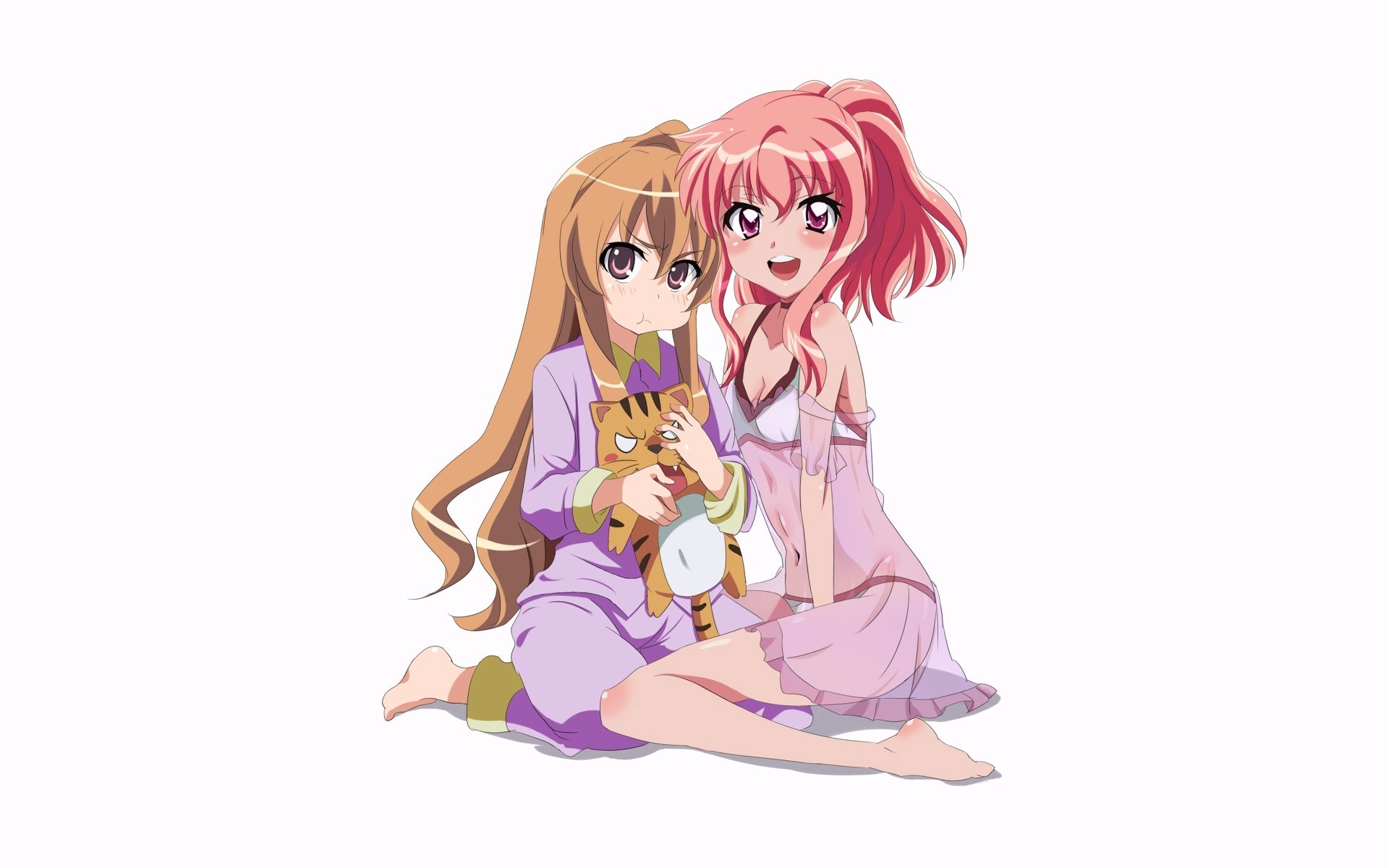Two girls with a cat plush
