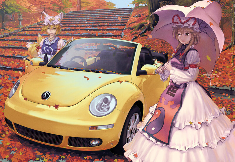 Two girls with a yellow car