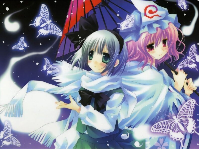 Two girls with butterflies at night