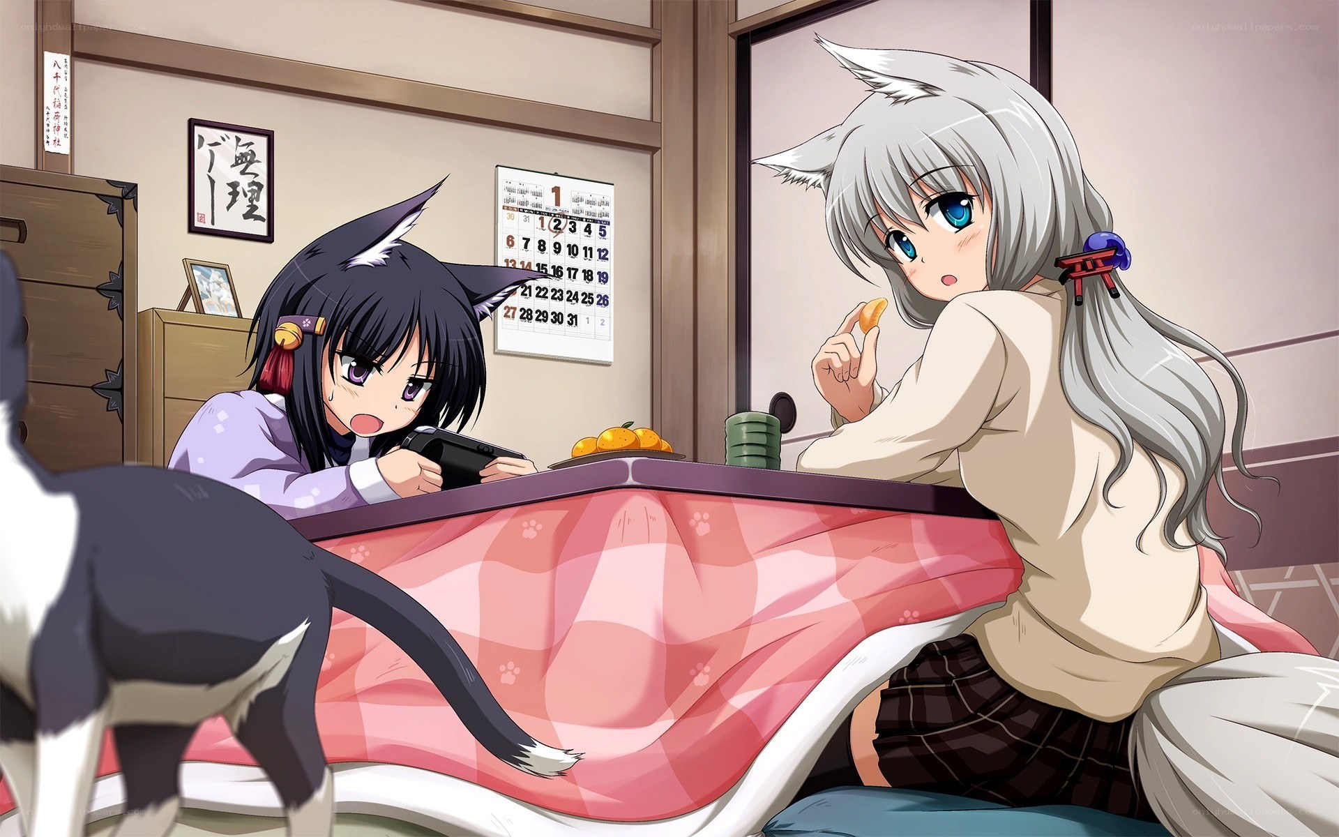 Two girls with cat ears at a table