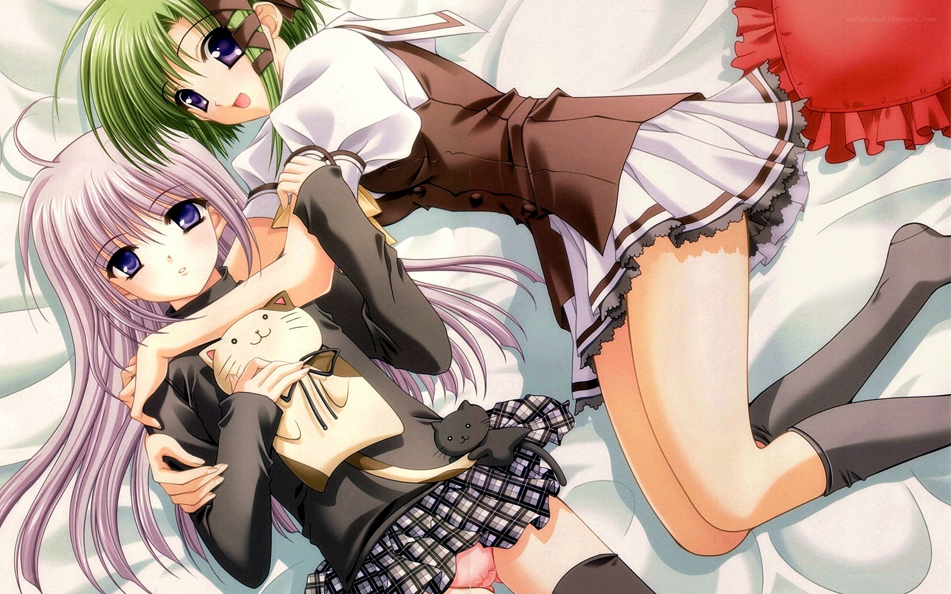 Two girls with cat plushies