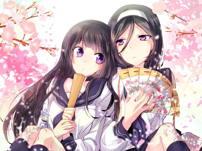 Two girls with fans under cherry blossoms