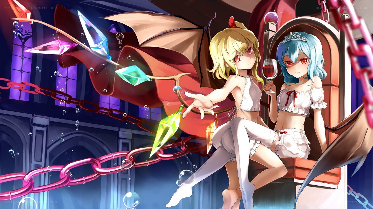 Two girls with gems and chains